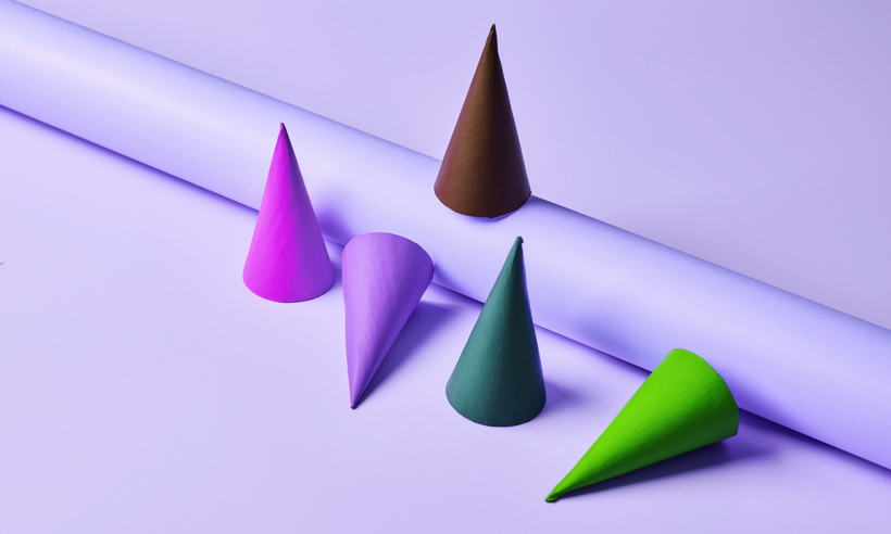 Colorful geometric shapes representing diverse perspectives in inclusive conflict management and team collaboration