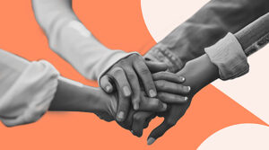 Image shows four hands coming together in the center, symbolizing unity and teamwork. The hands belong to individuals wearing different types of clothing, indicating diversity. The background features a contrasting orange and beige color scheme. The image conveys a strong message of collaboration and mutual support.