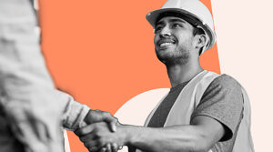 Image shows a young man in a hard hat and reflective vest smiling as he shakes hands with another person, whose arm is partially visible in the foreground. The background features a contrasting orange and beige color scheme. The scene conveys a sense of agreement, collaboration, and satisfaction in a work setting.