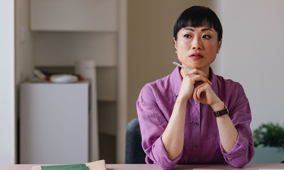 HR leader analyzing employee retention data and culture metrics at modern office desk